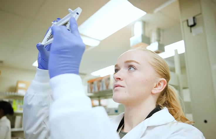 Understanding cancer biology female scientist